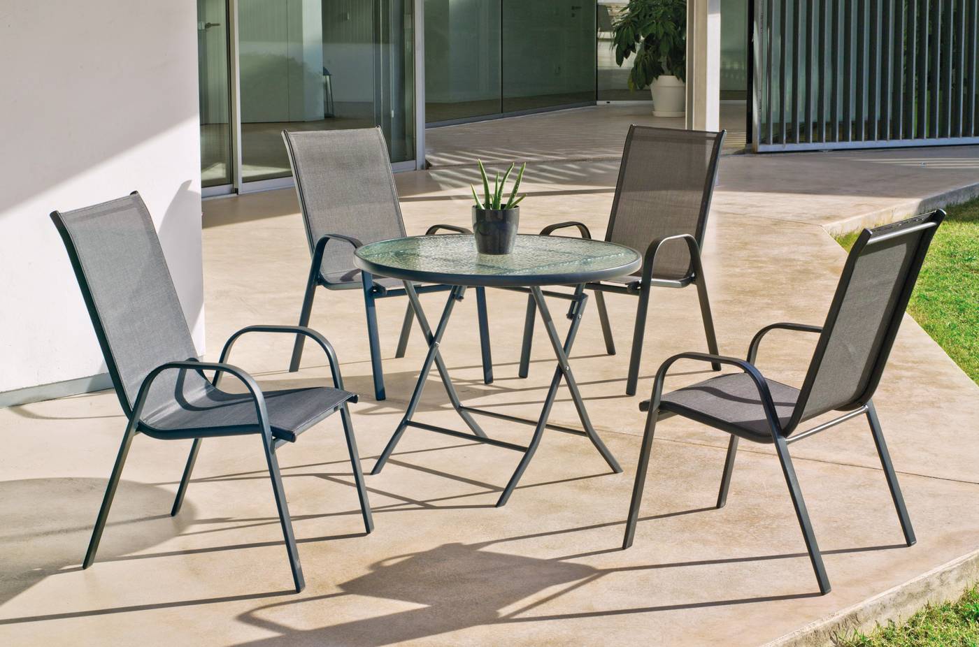 Conjunto de acero color antracita: mesa redonda de 90 cm. con tapa de cristal templado + 4 sillones de acero y textilen